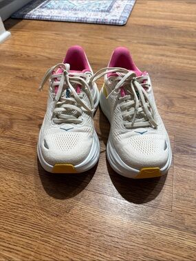 Hoka One One Cream Running Sneakers with Pink Lining and Yellow Accents